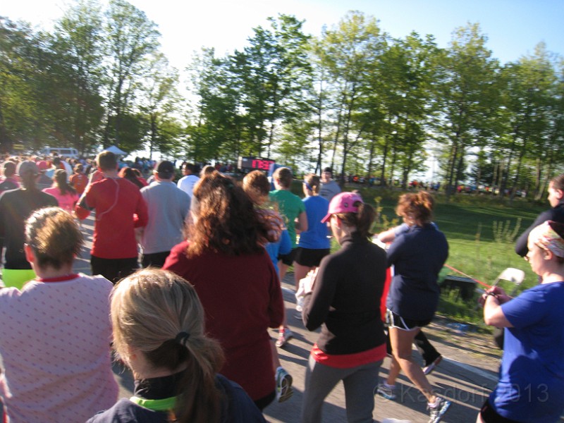2013 Bayshore Half 054.JPG - . . . and we are off! Must be close to the start line as everyone is pressing the start button on their stop watch's!